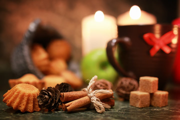 night cup of tea with candle and apple