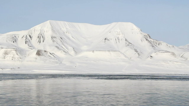 Ice coast of the Arctic Ocean. The surroundings of Longyearbyen, Svalbard. Norway. A sunny day in March.