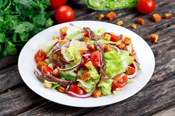 Fresh healthy Classic Caesar salad with anchovies.