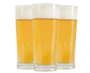 Frosty glass of light beer set isolated on a white background