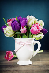 Beautiful tulips bouquet  on wooden table