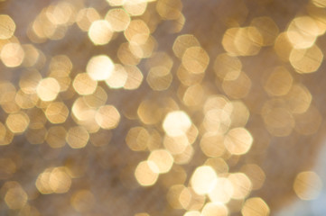 Fototapeta na wymiar brown with gold blurred background bokeh