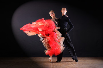 dancers in ballroom isolated on black background