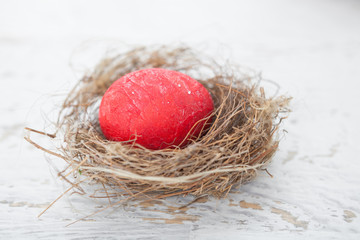 Colorful homemade easter eggs in nest
