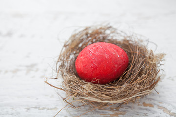 Colorful homemade easter eggs in nest