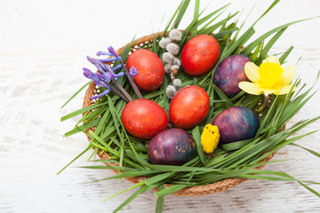 Colorful homemade easter eggs in nest