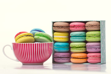 Collection of brightly colored French macarons are in a holiday