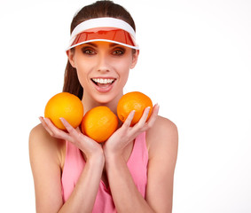 Beautiful close-up young woman with oranges. Healthy food concep