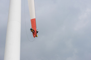 repair work on the blades of a windmill for electric power production