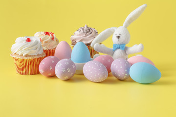 Easter bunny with egg on yellow background