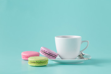 Fototapeta na wymiar French macarons and coffee cup