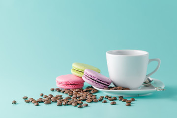 A cup of coffee on a saucer on a aquamarine background
