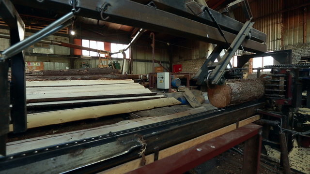 Woodworking. View on running machine for sawing