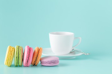 French macaroons with cup of coffee