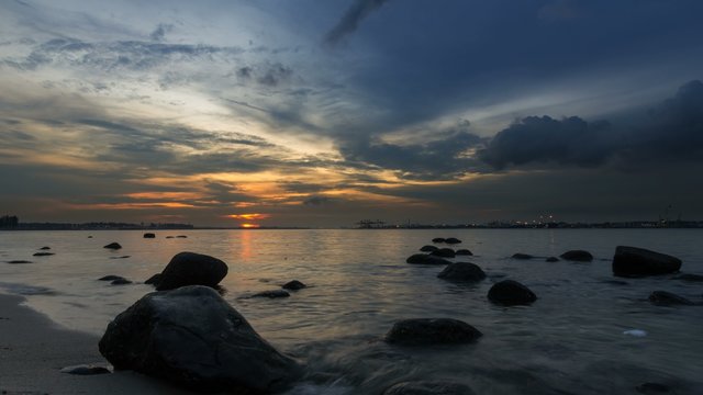 Ultra high definition 4k time lapse movie of moving clouds and river from sunset into blue hour at Punggol in Singapore 4096x2304