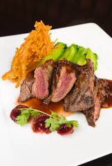 Flame grilled ,rare kangaroo steak loin, served with pak choi and a red wine sauce