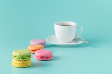 French macaroons with cup of coffee