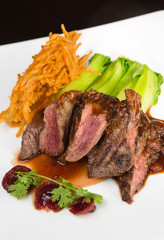 Flame grilled ,rare kangaroo steak loin, served with pak choi and a red wine sauce