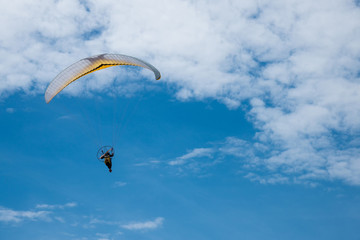 Paragliding in blue sky
