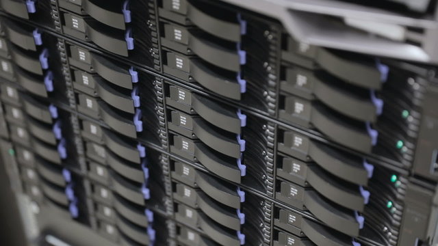 Close up of hard drives in large SAN storage