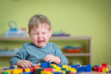 Tearful boy in nursery 