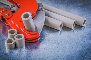 Composition of plumbers tools on metallic background constructio