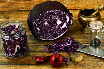 Red Cabbage on Wood Background with Knife. 