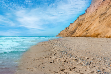 Tropical beach with a steep slope and the turquoise waters of th