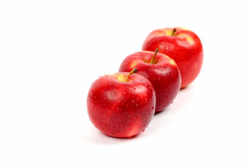 three red apple on white background
