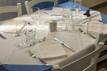 Dressed table with blue and white cloths