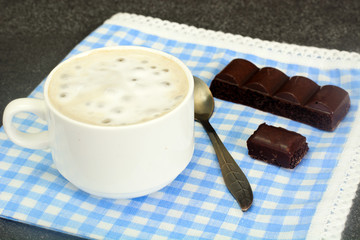 Cup of Coffee with Chocolate  on Dark Background in Retro Vintag