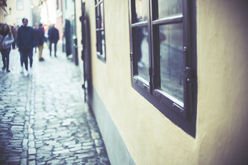 Homes along the golden lane in prague castle, full of tourist, focus on window, vintage effect