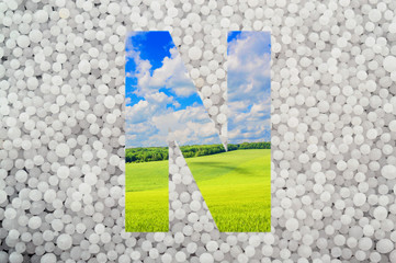 Letter N on mineral fertilizers background. N - Nitrogen (carbamide, urea)