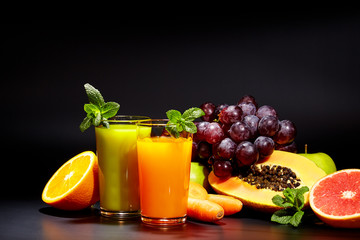 Glasses with fresh vegetable juices isolated on black. Detox 