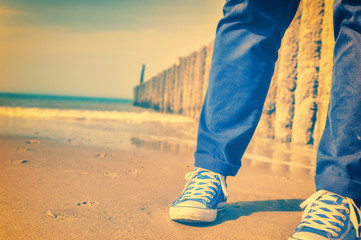 Summer seascape with relaxing teenager