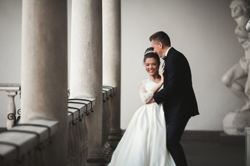 Fototapeta premium Luxury married wedding couple, bride and groom posing in old city
