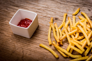 Fries on a wooden table
