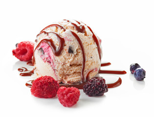 Ice cream ball with chocolate sauce and frozen berries