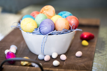 Fototapeta na wymiar Colored Easter Eggs In A Bowl