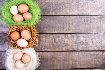 Easter eggs  on wooden background. Top view. 