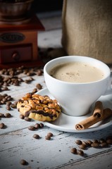 Coffee, roasted beans, mill grinder and some sweets