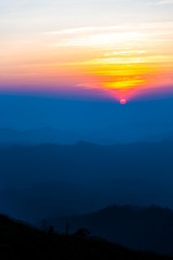 sunset over mountain in evening