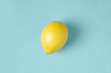 one lemon on a blue background