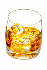 Glass of whiskey with ice on a white background