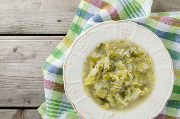 Cabbage soup on wooden table