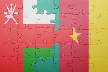 puzzle with the national flag of oman and cameroon