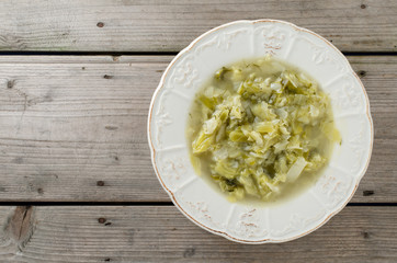 Cabbage soup on wooden table