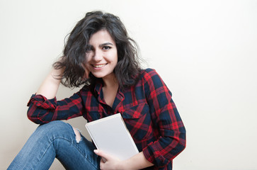 Young woman student smiling with book