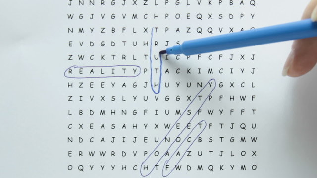 Word search puzzle with truth being circled in blue pen with supporting words in text.