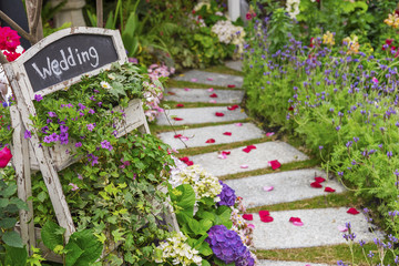 Romantic path to wedding banquet in beautiful green garden